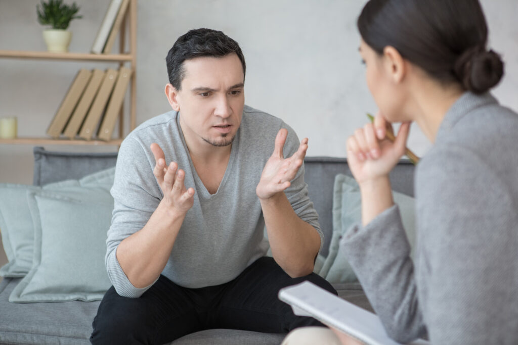 adult man sitting discussing with EMDR